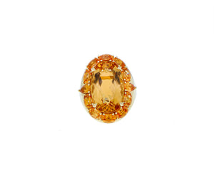 Yellow gold ring with topaz and spessartite