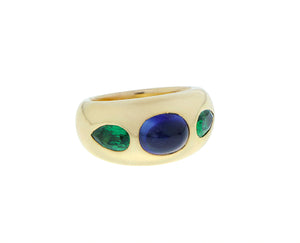Yellow gold gypsy ring with a cabochon cut sapphire and tsavorites