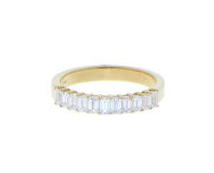 Yellow gold ring with emerald cut diamonds