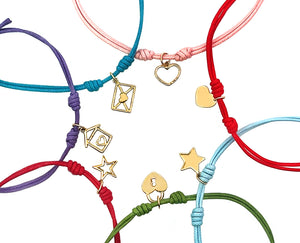 Rope bracelets with dangling yellow gold charms