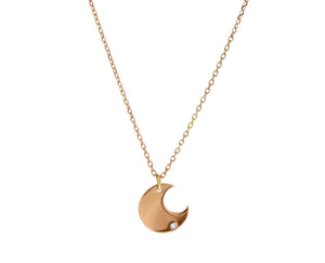 Rose gold and diamond necklace with a moon pendant