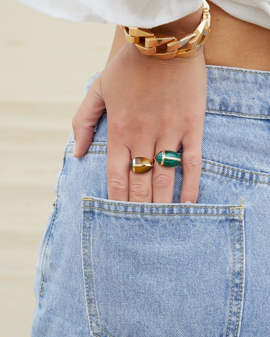 Gold ring with a malachite or tiger eye scarab