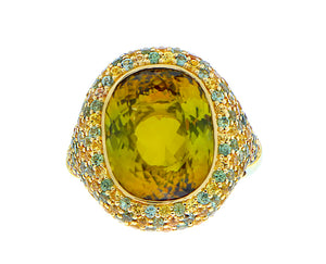 Yellow gold ring with a yellow tourmaline and sapphires