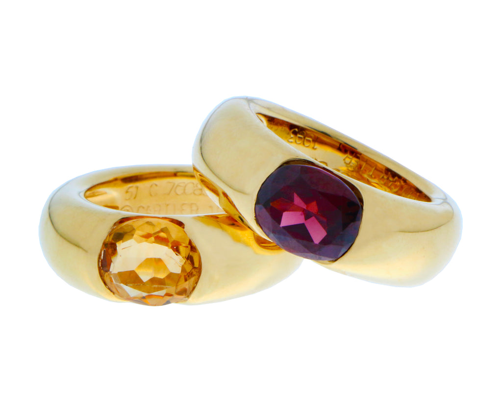 Yellow gold Cartier Ellipse rings with citrine and garnet