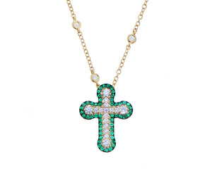 Yellow gold necklace with a diamond and emerald cross