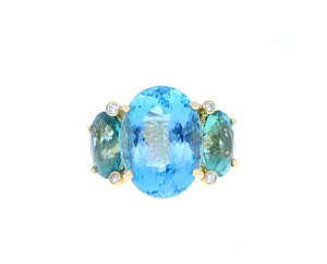 Yellow gold ring with diamonds, aquamarine and two green tourmalines