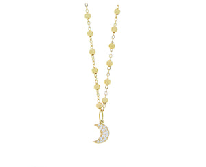 Yellow gold ball necklace with a diamond moon pendant