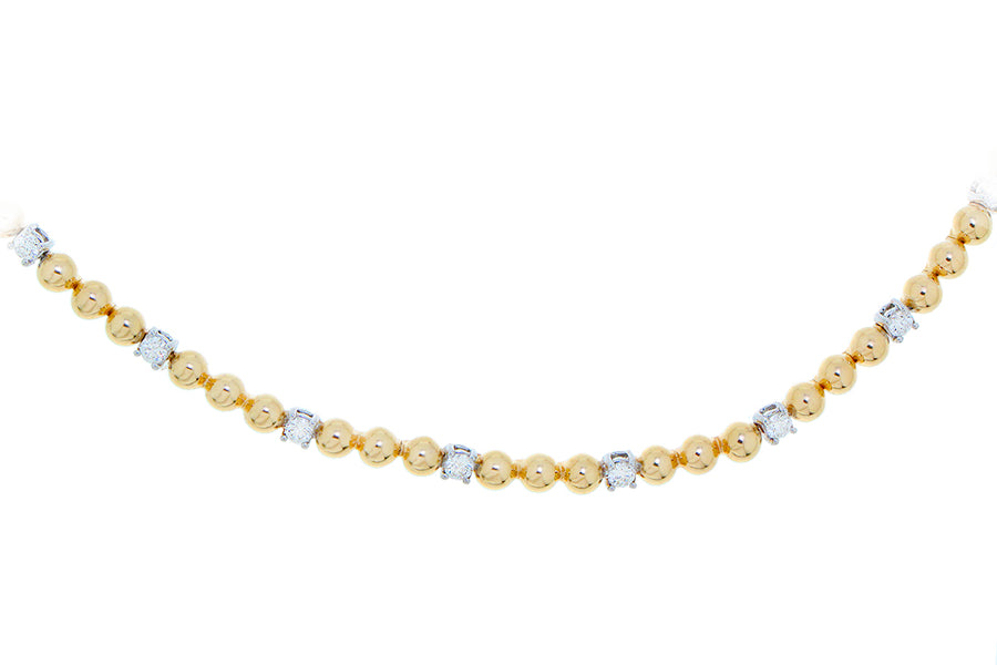 Yellow gold ball and diamond necklace