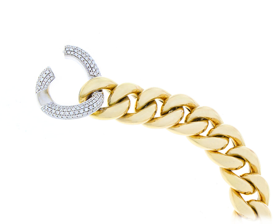 Yellow gold gourmet chain bracelet with a diamond link closure