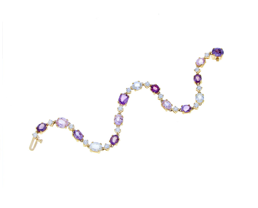 Yellow gold with diamonds and multi color sapphires