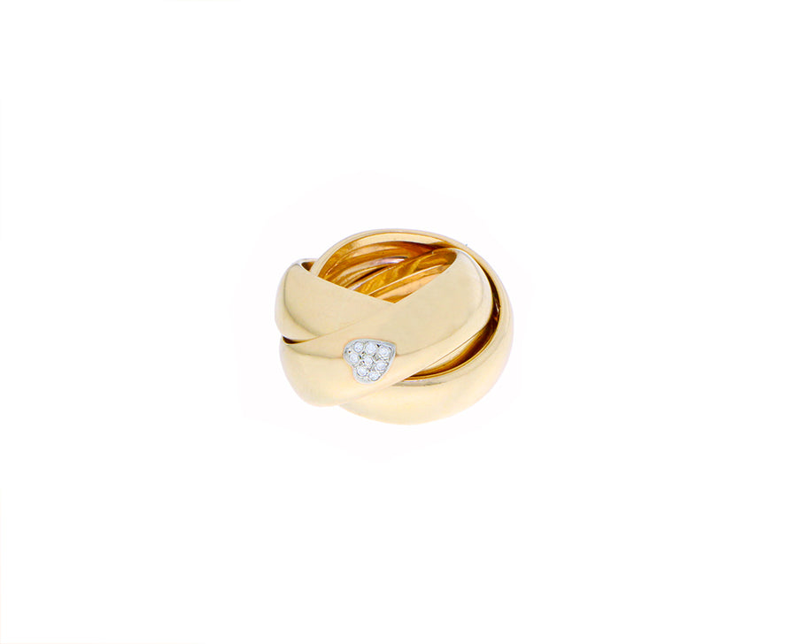 Three yellow gold rings with one diamond heart