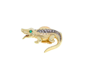 Yellow gold crocodile brooch with an emerald eye and diamond back