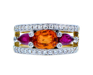 Yellow gold ring with diamonds , an oval spessartite and ruby