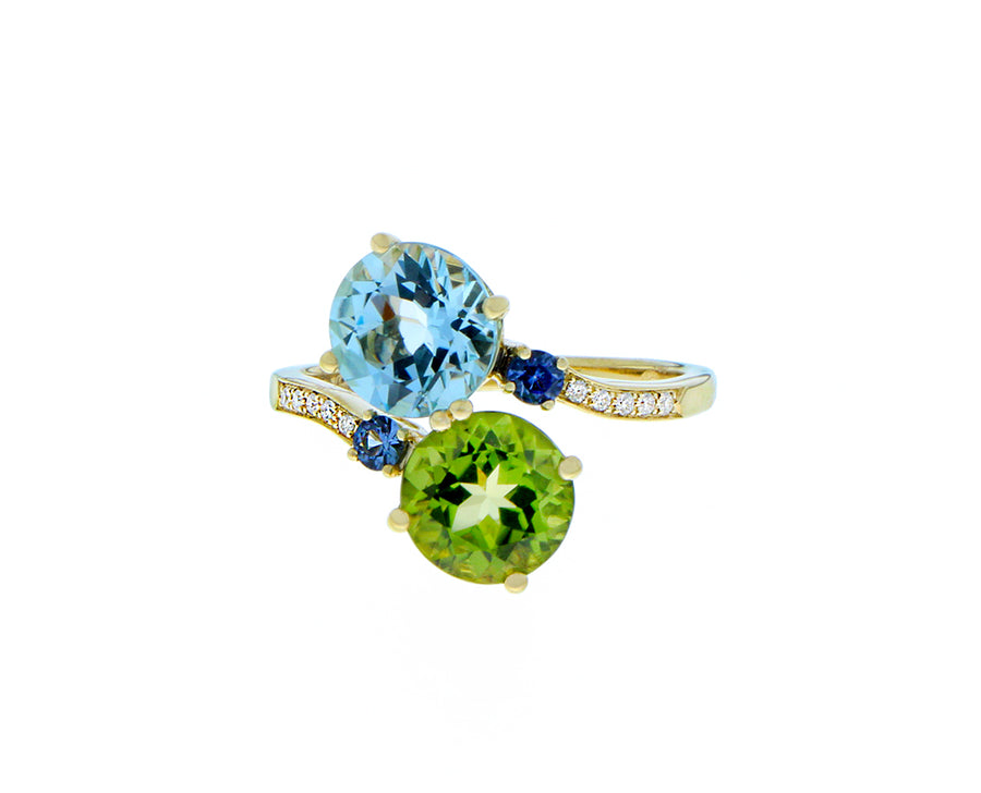 Yellow gold diamond ring with topaz, peridots and sapphires
