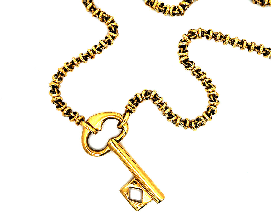 Yellow gold Pomellato necklace with key pendant