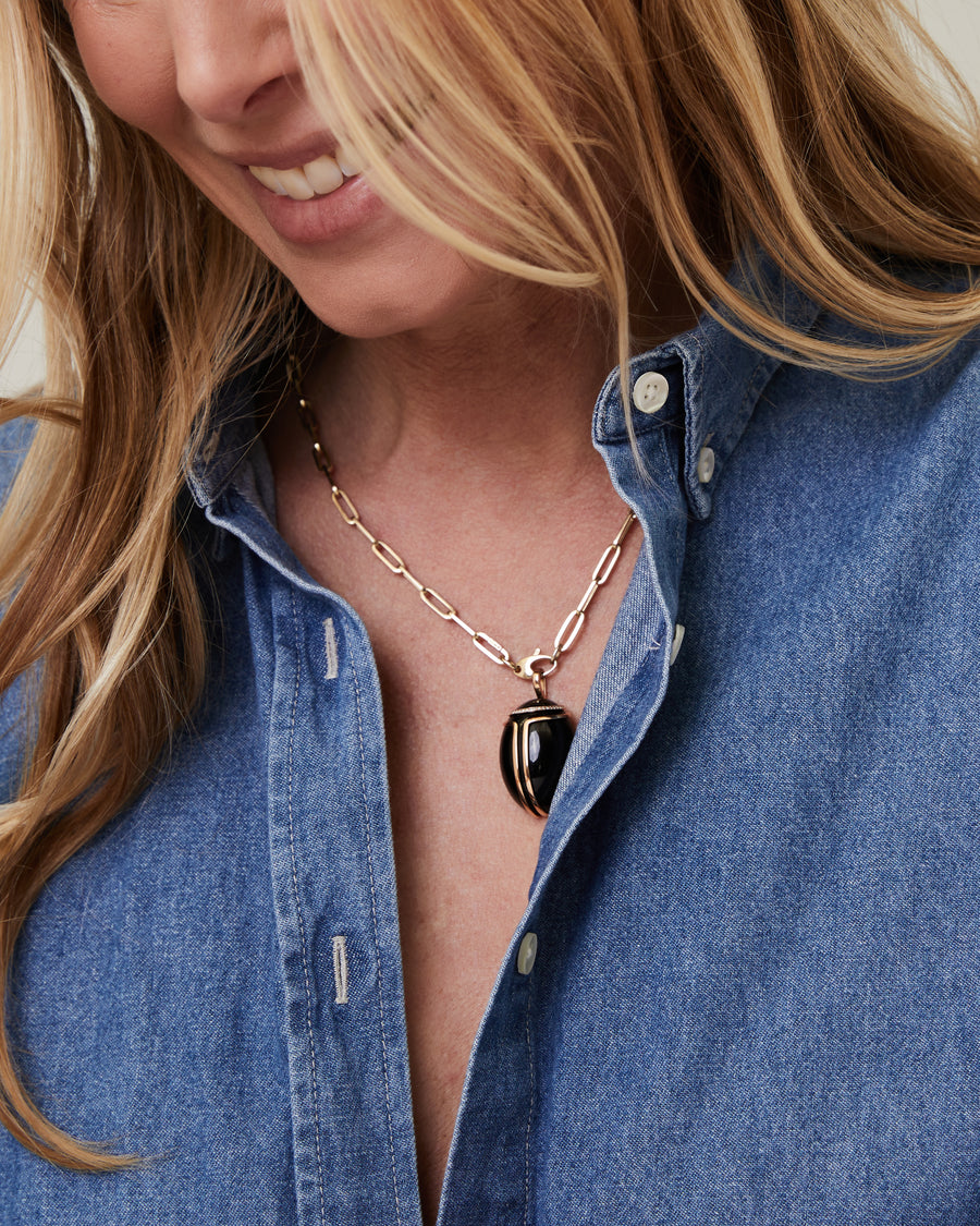 Rose gold and diamond cabochon cut onyx scarabee pendant