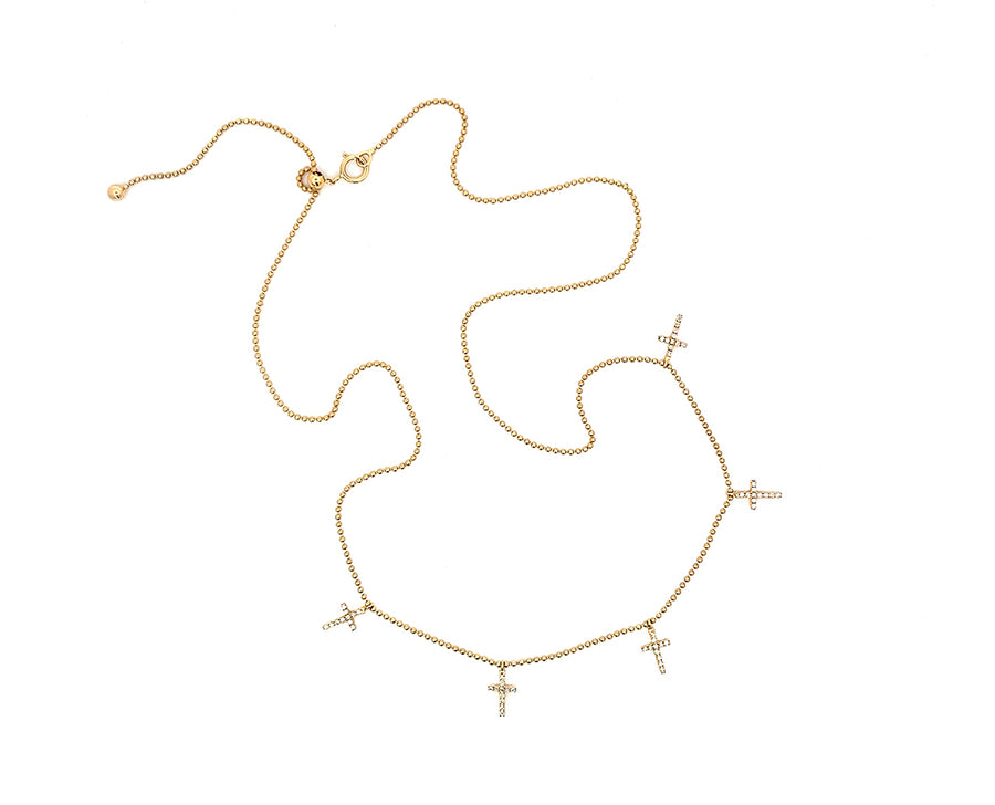 Yellow gold necklace with five small diamond cross charms