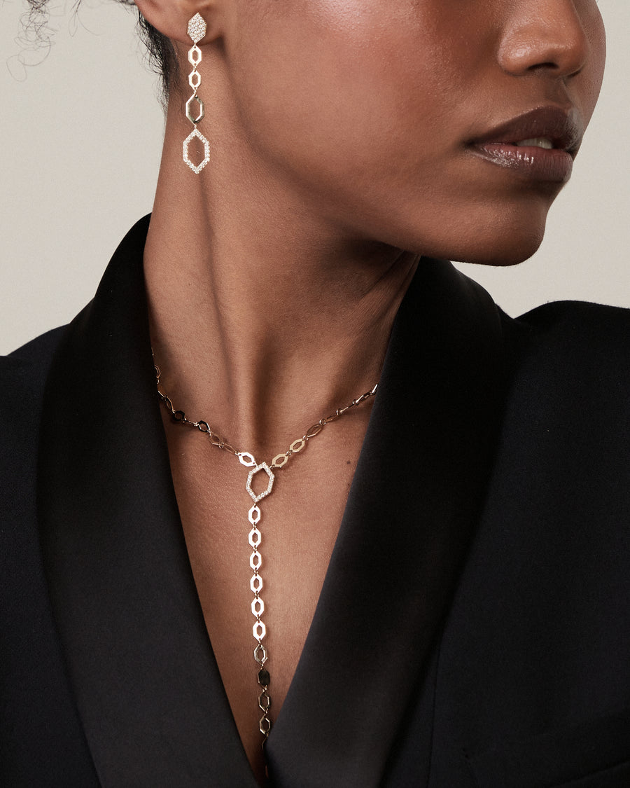 Yellow gold diamond-shaped chain earrings with diamonds