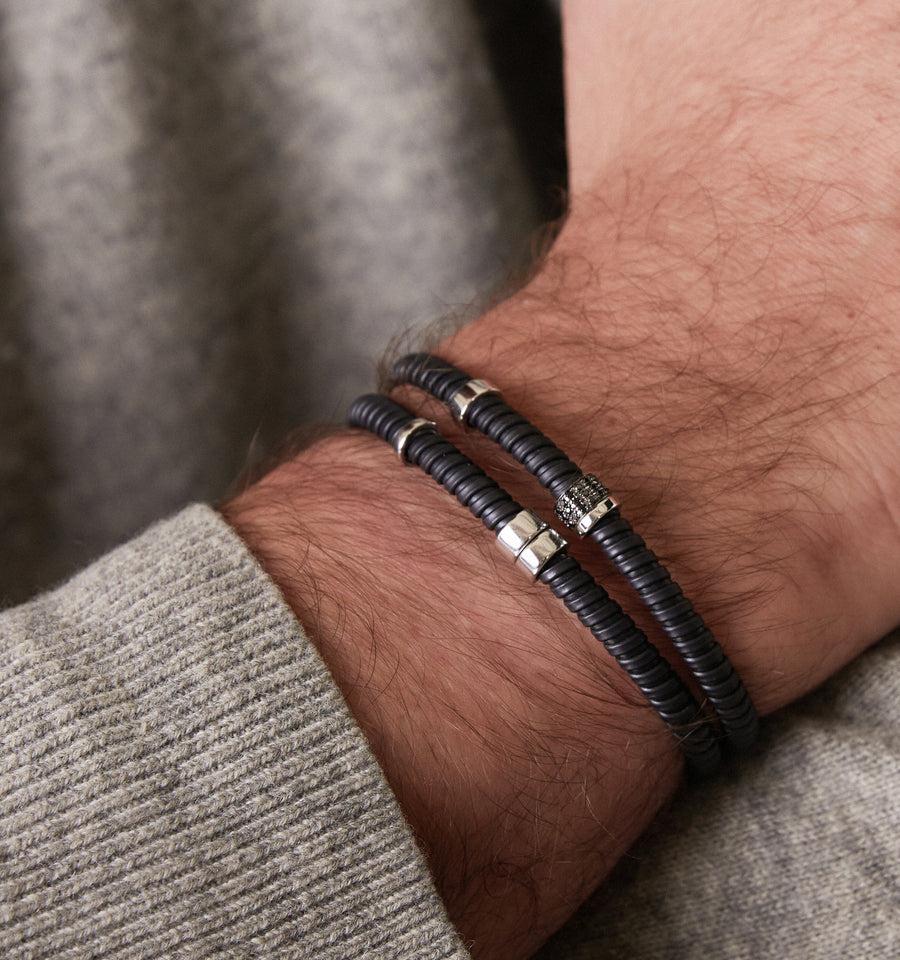 Black steel tubo bracelet with gold and diamond elements