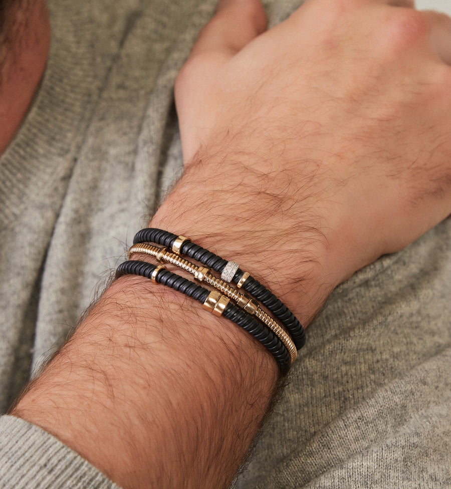 Black steel tubo bracelet with gold and diamond elements