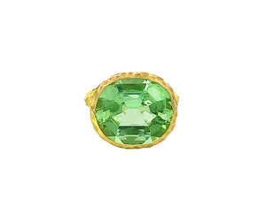 Yellow gold hammered ring with a light green tourmaline