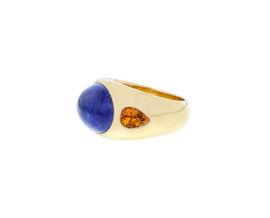 Yellow gold gypsy ring with spessartites and a cabochon cut tanzanite