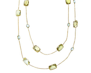 Yellow gold necklace with different shaped gemstones