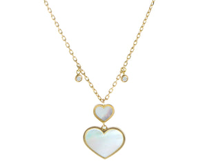 Yellow gold necklace with diamonds and white mother of pearl heart pendants