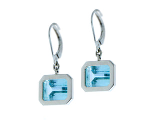 White gold earrings with blue topaz