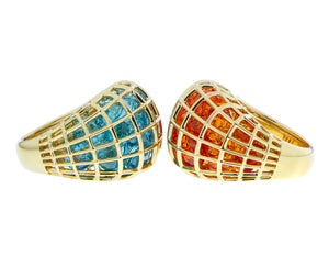 Yellow gold cage rings with blue zircon and orange spessartine garnets