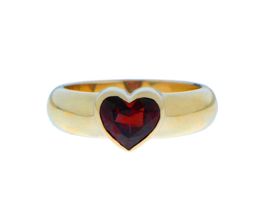Yellow gold ring with a heart shaped green tourmaline, topaz or garnet