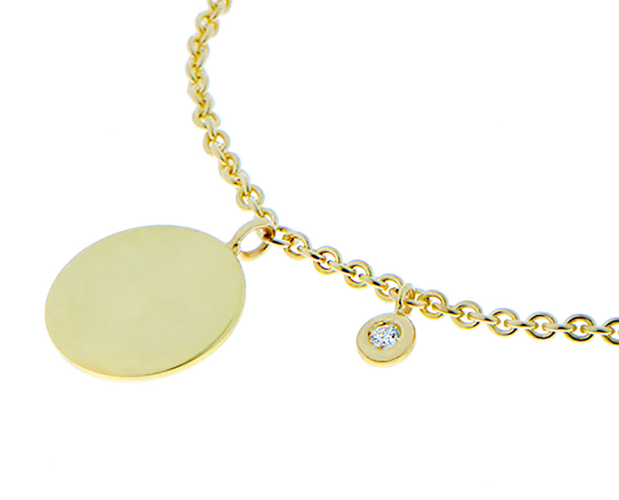 Yellow gold bracelet with a coin and diamond pendant