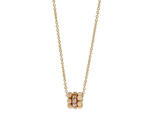 Rose gold and diamond necklace with a three ring pendant