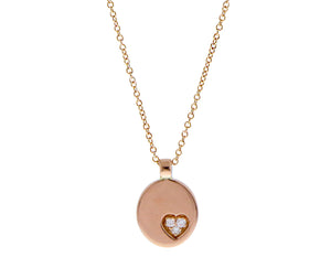 Rose gold necklace with an oval pendant and diamond heart