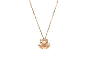 Rose gold necklace with a diamond eyed frog pendant