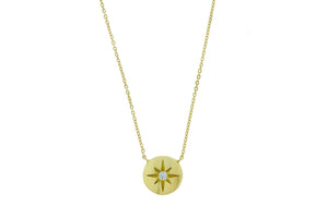 Yellow gold necklace round pendant and a diamond star