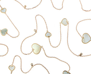 Rose gold necklace with mother of pearl hearts and diamond pendants