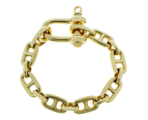 Yellow gold marina link bracelet with a harp closure