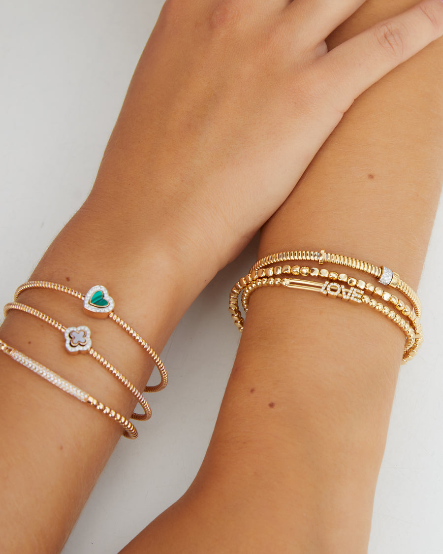 Rose gold tubo bracelet with a diamond and malachite heart