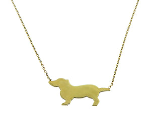 Yellow gold necklace with a dog pendant