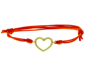 Yellow gold heart with an orange colored rope bracelet