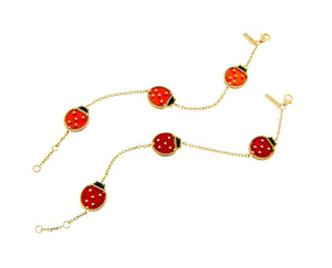 Yellow gold bracelet with three ladybugs