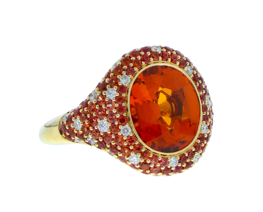 Yellow gold ring with a spessartite, diamonds and sapphires