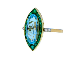 Geelgouden ring met een blauwe topaas, smaragden en diamanten