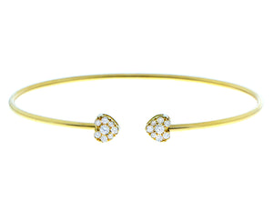 Yellow gold bangle with two diamond hearts