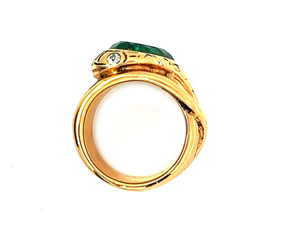 Yellow gold snake ring with diamond eyes and emerald head