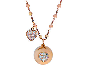 Rose gold necklace with a rose gold ball, a diamond heart and a loose dangling diamond heart