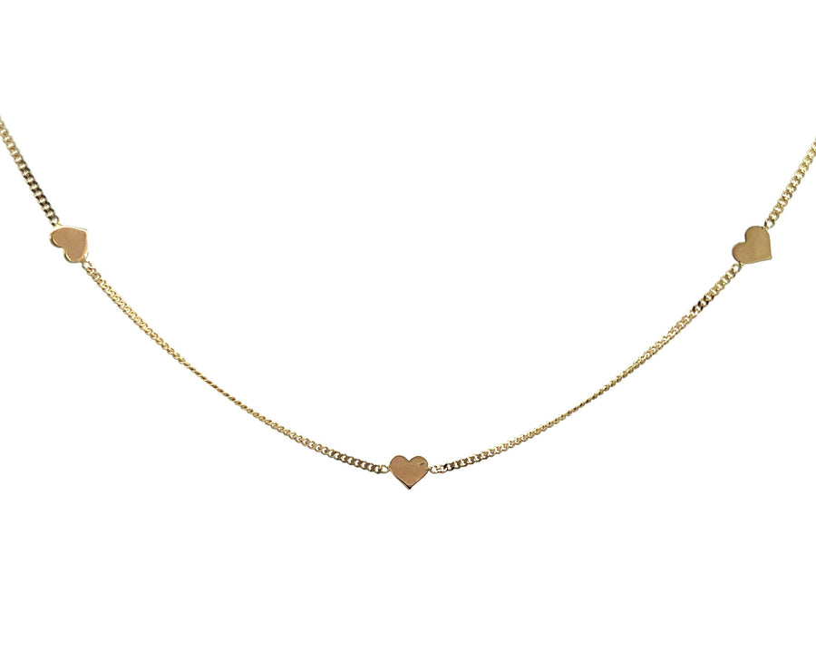 Yellow gold necklace with charms